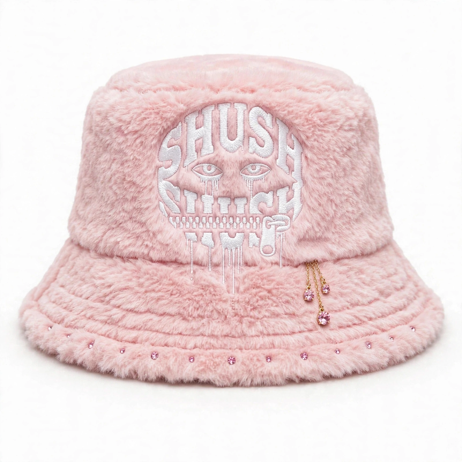 Pink faux-fur SHUSH bucket hat with a white dripping logo, pink gem dangle and small pink gems along the front brim